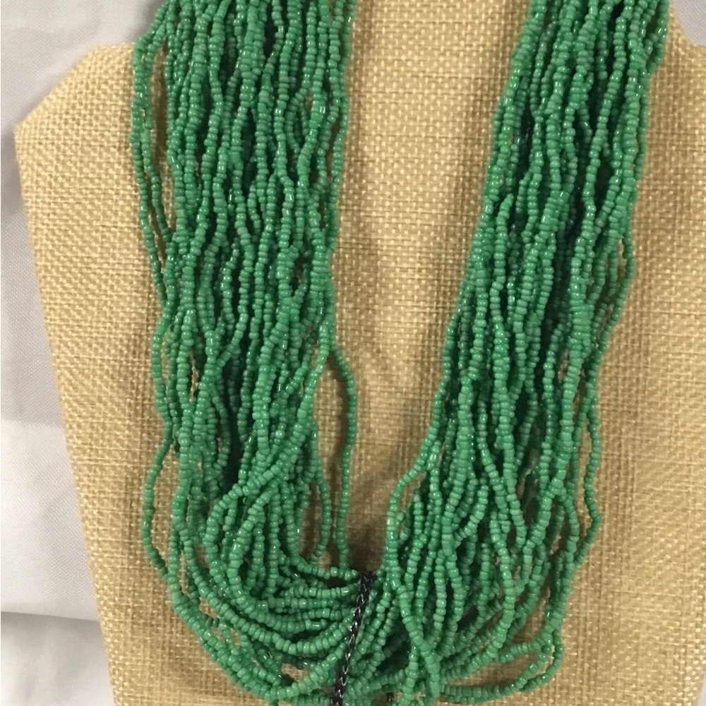Jerollin multi strand seed bead choker necklace. Extends to 20 “